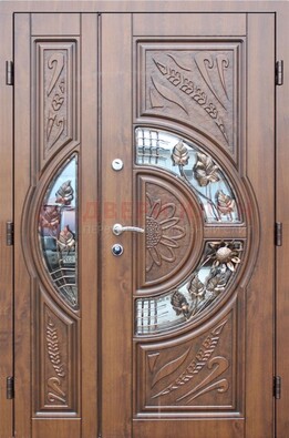 Уличная дверь в цвете Итальянский орех с виноритом и ковкой со стеклом ДВТ-147 в Голицино